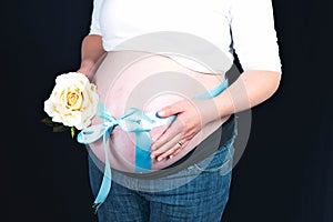 Pregnant woman and blue ribbon