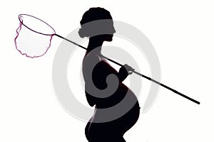 Pregnant woman with a butterfly net