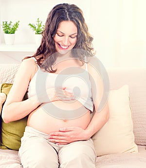 Pregnant woman caressing her belly