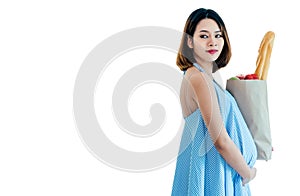 Pregnant woman carrying a food bag. She looks happy And healthy. White background