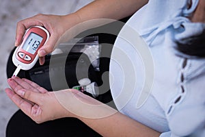 Pregnant woman checkup blood control risk sugar level for gestational. Female pregnancy health glucose measurement meter concept photo