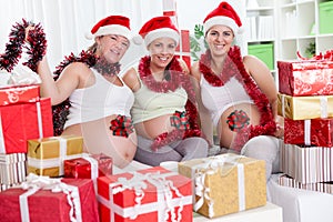 Pregnant woman with Christmas presents