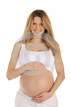 Pregnant woman clasps her hands on stomach