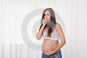 Pregnant woman with a cough. Pregnancy health and medcine contest. Illness, cold, flu, allergy photo