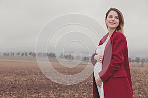 Pregnant woman at countryside