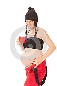 Pregnant woman with cup of tea