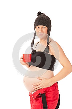 Pregnant woman with cup of tea