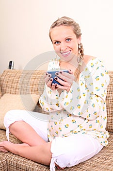 Pregnant woman with a cup of tea