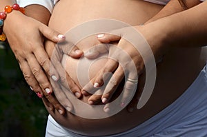 Pregnant woman with cute heart shaped