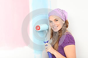 pregnant woman deciding to paint nursery pink or blue. photo