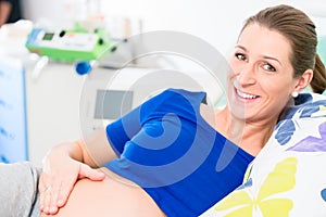 Pregnant woman in delivery room waiting to give birth