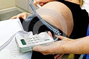 Pregnant woman in doctor`s office