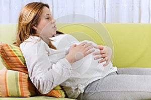 Pregnant woman doing breathing exercises