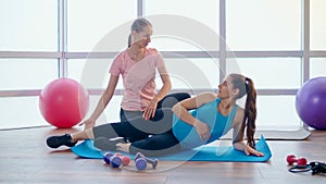Pregnant Woman Doing Exercises for Pregnant Women with a Personal Trainer