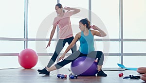 Pregnant Woman Doing Exercises for Pregnant Women with a Personal Trainer