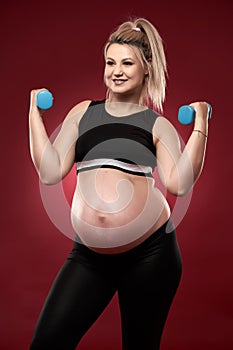 Pregnant woman doing fitness