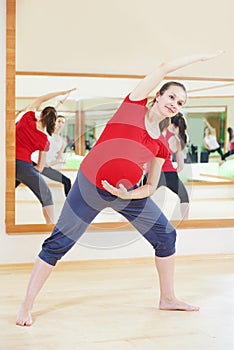 Pregnant woman doing fitness exercise