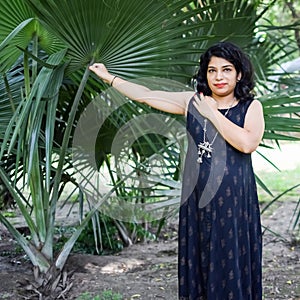 Pregnant woman doing Pregnancy yoga pose comfortable at society park with belly, Pregnant woman practicing simple yoga steps at