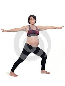 pregnant woman doing standing exercises on white background, warrior pose