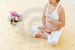 Pregnant woman doing yoga exercise