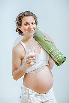 Pregnant woman doing yoga exercise