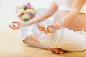 Pregnant woman doing yoga exercise