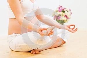 Pregnant woman doing yoga exercise