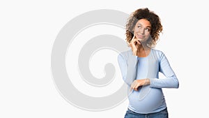 Pregnant woman dreaming, imagining motherhood life, free space