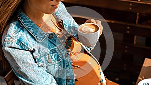 Pregnant woman drink coffee. Lifestyle morning with happy pregnancy girl drink espresso coffee. Concept for coffee