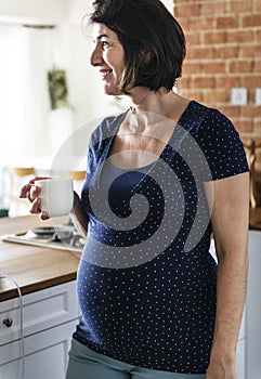Pregnant woman drinking hot milk