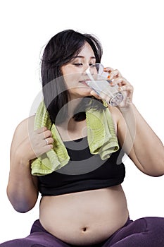 Pregnant woman drinking water