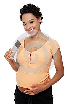 Pregnant woman eating chocolate