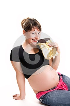 Pregnant woman eating chocolate