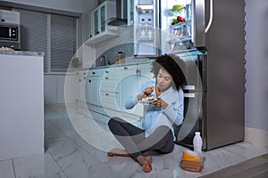 Pregnant Woman Eating Piece Of Cake