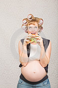 Pregnant Woman Eating a Sandwich