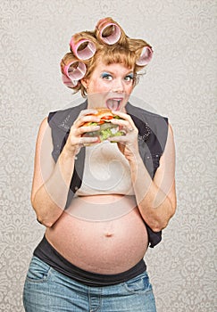 Pregnant Woman Eating a Sandwich