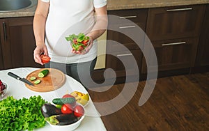 A pregnant woman eats vegetables and fruits. Selective focus