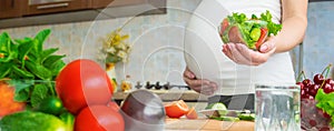 A pregnant woman eats vegetables and fruits. Selective focus.