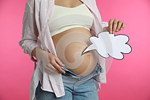Pregnant woman with empty paper thought cloud on pink, closeup. Choosing baby name