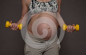 Pregnant woman is engaged in the gym