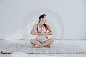 A pregnant woman is engaged in gymnastics and yoga