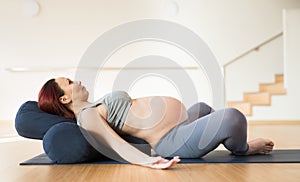 Pregnant woman is engaged in yoga