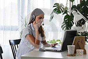 Pregnant woman entrepreneur working from home on laptop computer at home