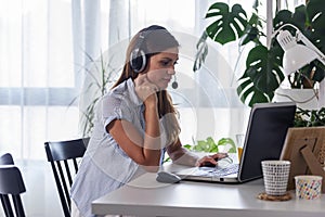 Pregnant woman entrepreneur working from home on laptop computer at home