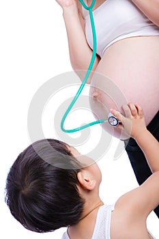 Pregnant woman examining her tummy photo