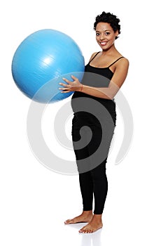 Pregnant woman excercises with gymnastic ball