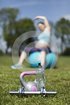 Pregnant woman excercises with gymnastic ball photo