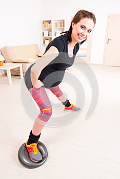 Pregnant woman exercising at home