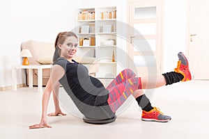 Pregnant woman exercising at home