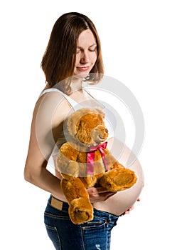 Pregnant woman, expectant mother on white background, close-up of pregnant belly